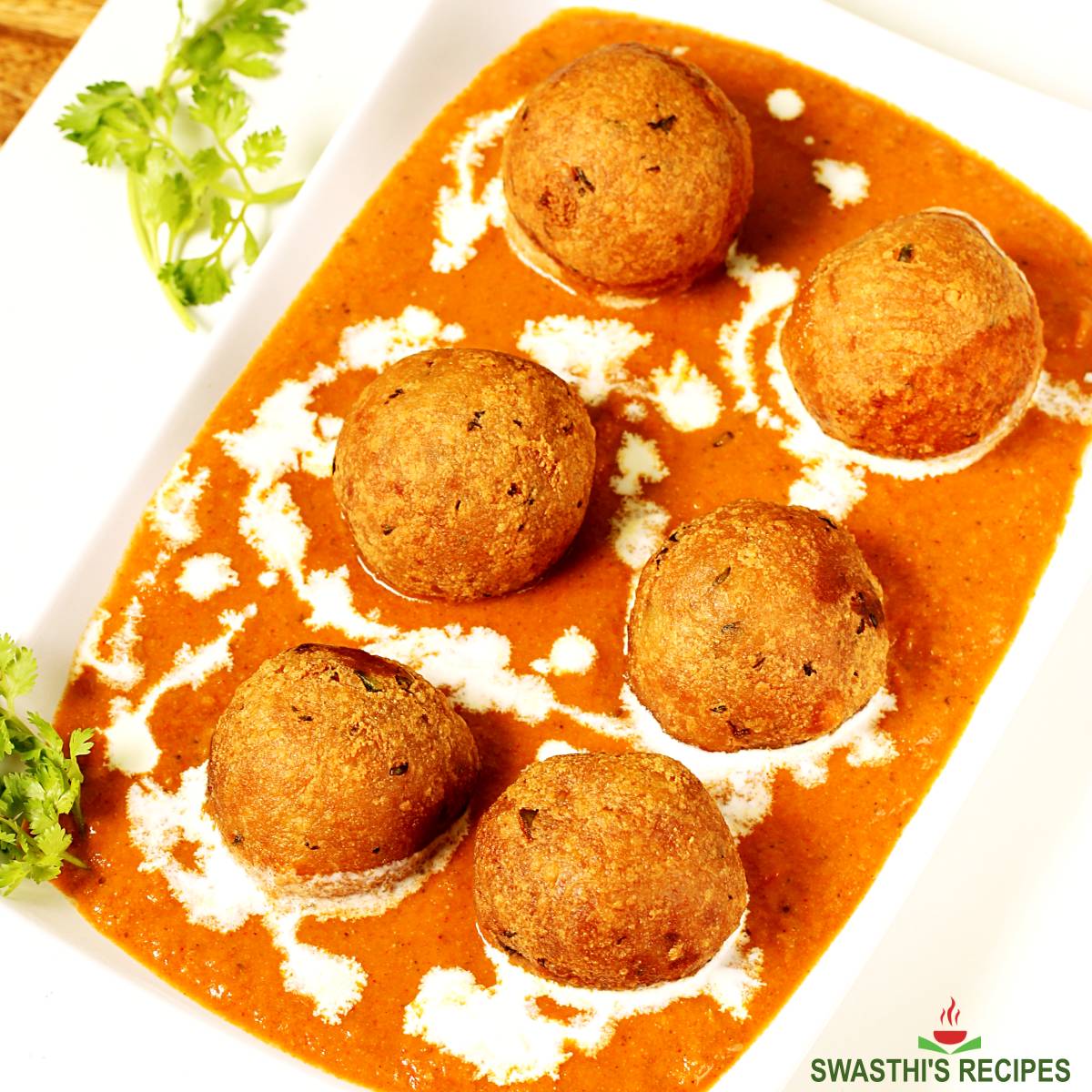 Malai kofta made with potato paneer spices and onion tomato masala