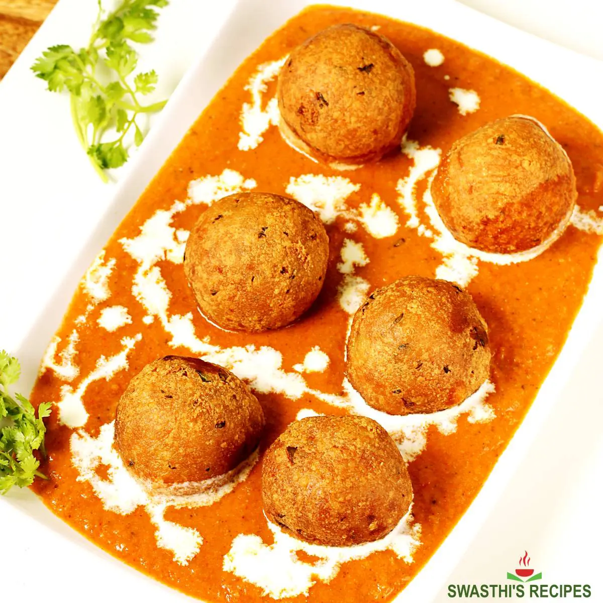 Malai kofta made with potato paneer spices and onion tomato masala