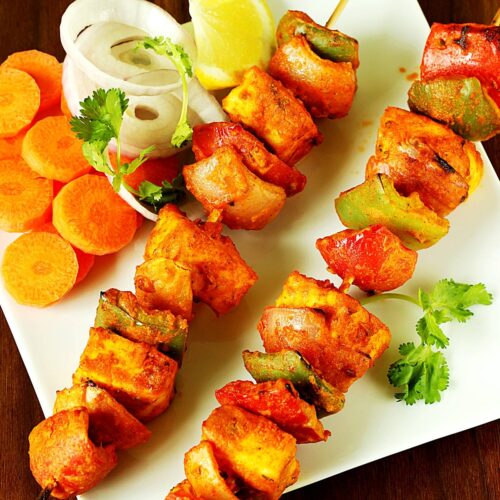 paneer tikka is a grilled tandoori appetizer made with paneer and spices