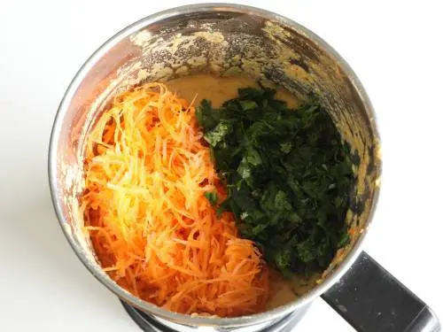 add grated carrots and coriander leaves