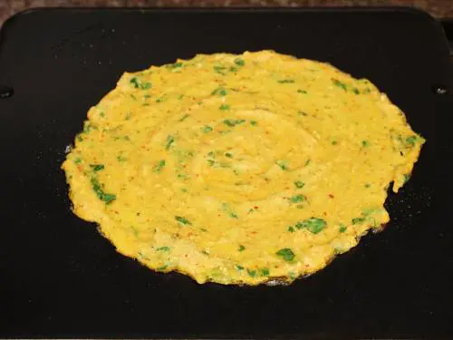 drizzle ghee to cook moong dal chilla