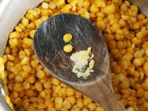 mashed lentils in a spoon