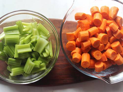 celery and carrots in a bowl to juice