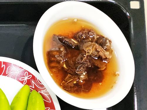 soaked tamarind in a bowl of hot water