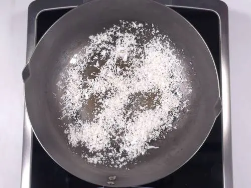 dried coconut in a pan