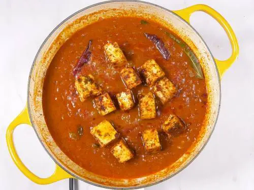 add fried paneer in ghee to the curry