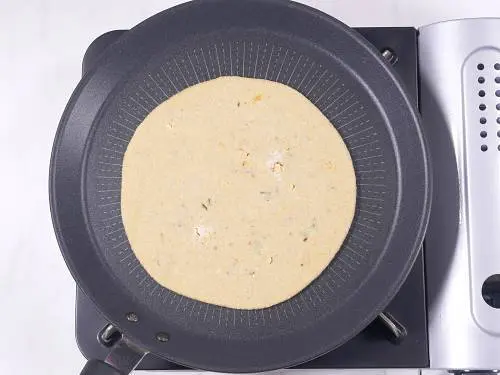 place paneer paratha on a hot tawa