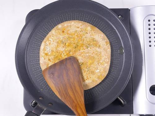 press down with a spatula