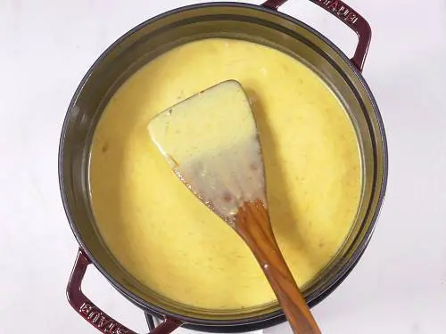 cooking kadhi in a pot