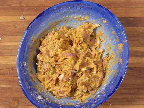 kadhi pakora batter in a bowl