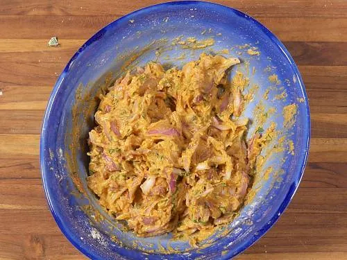kadhi pakora batter in a bowl