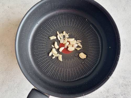 fry garlic to make aloo bhindi