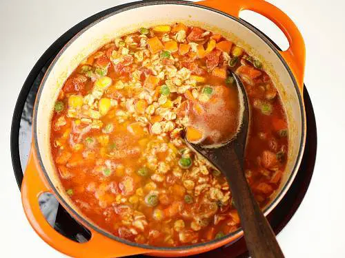 cooking masala oats in a pot