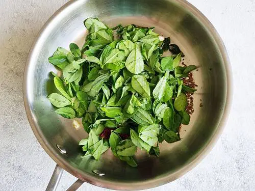 methi leaves in a pan