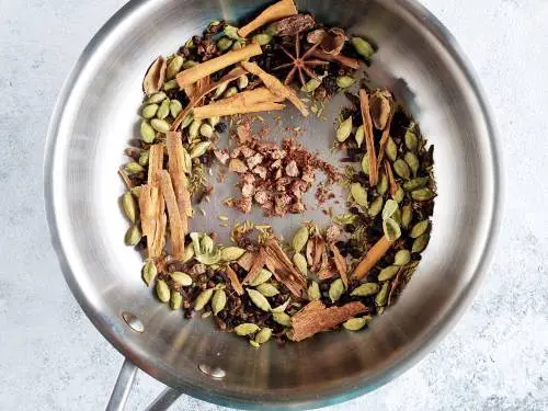 nutmeg in a pan for chai spice