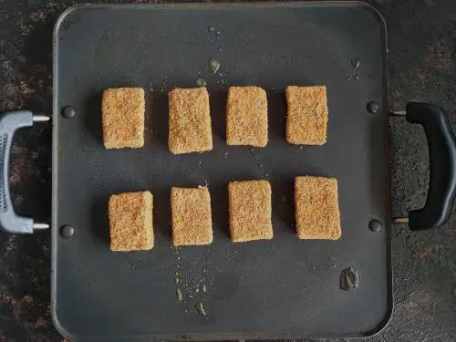 marinated paneer on a hot pan