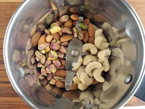 nuts in a a grinder