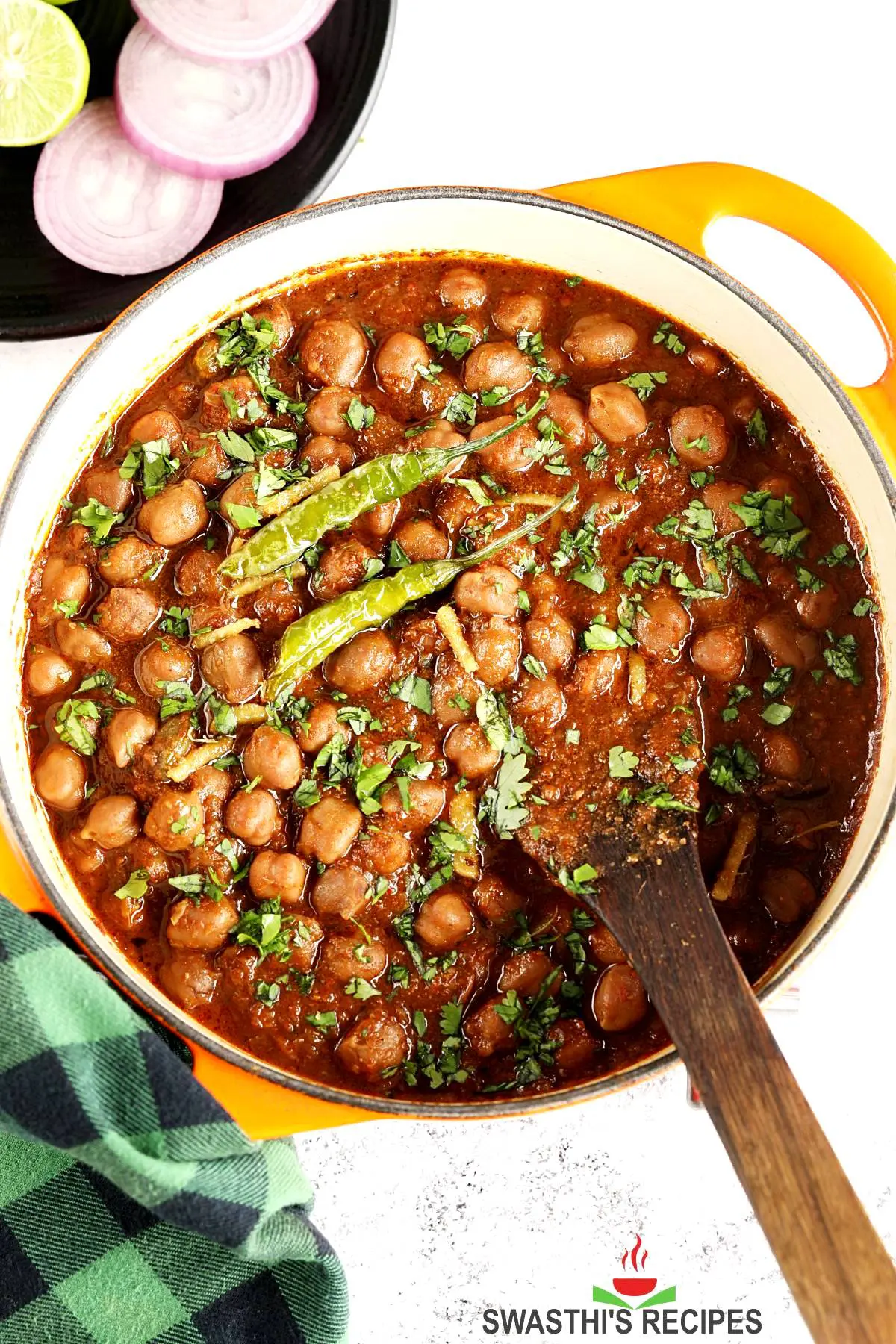 Punjabi chole garnished with ginger and fried chilies