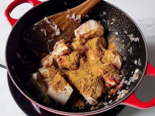 kadai masala being sprinkled on chicken