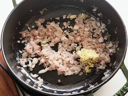 saute onions to make aloo gobi