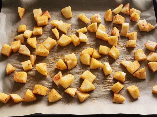 spiced potatoes in a baking tray