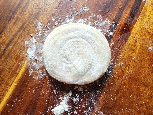 dust flour on dough