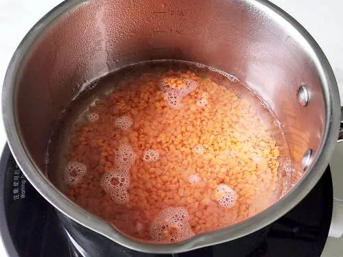 cook red lentils in a pot