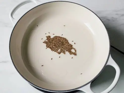 cumin seeds spluttering in oil