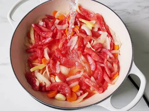 onions and tomatoes in a pan