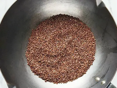 toasting flaxseeds in a pan