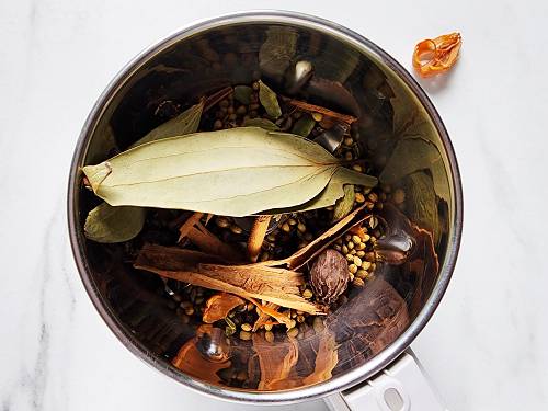 whole spices in a grinder