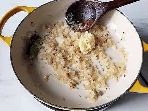 sauteed onions in a pan with ginger garlic