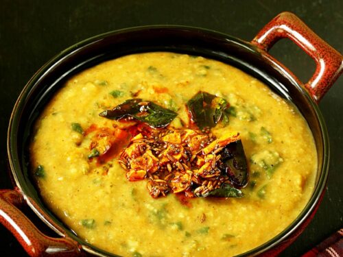 Dal Palak served in a brown bowl