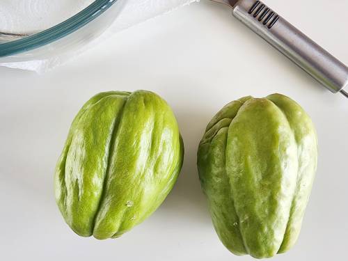 chayote ready on the table, to be peeled