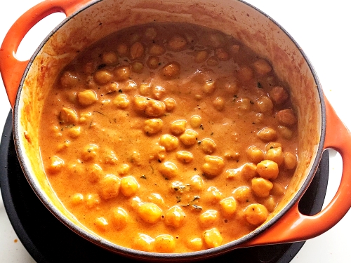 creamy butter chickpeas simmering in a pot