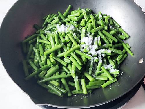 adding salt to the pan