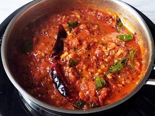 cooked tomatoes in a pan