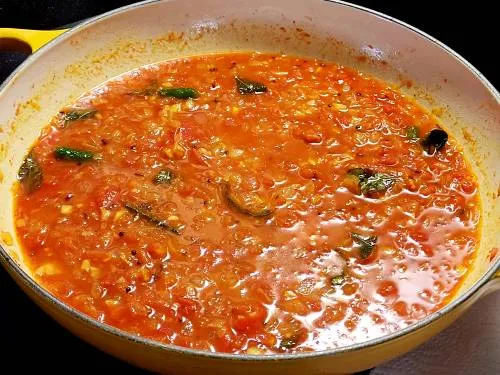 simmering onion tomato masala with water