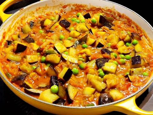 simmering brinjals in curry