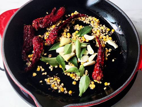 Frying dal, ginger garlic and herbs