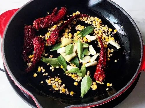 Frying dal, ginger garlic and herbs