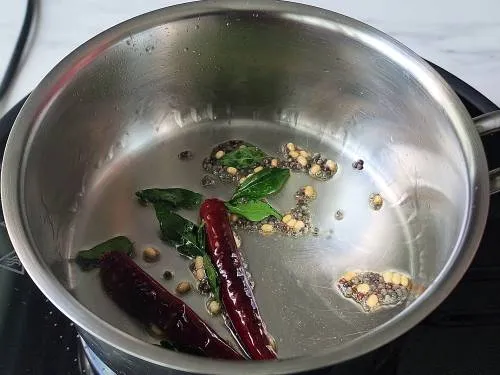 Tempering spices to garnish tomato chutney