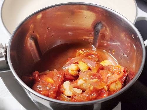 cooked onions and tomatoes in a blender