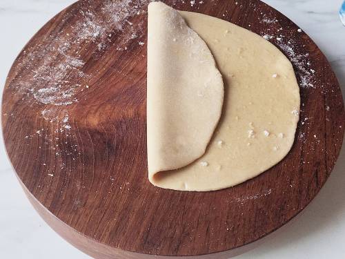 folding layers of dough to make paratha