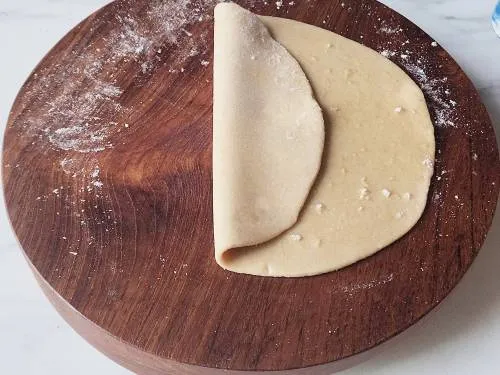folding layers of dough to make paratha