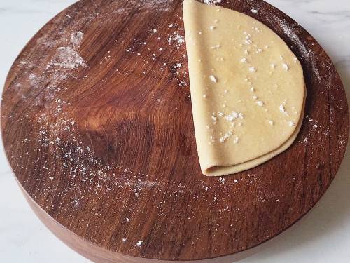 semi circle dough on a rolling board