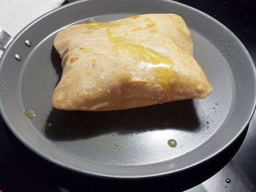 puffing plain parathas on a pan