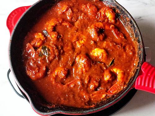 fiery and delicious shrimp vindaloo simmering in a skillet