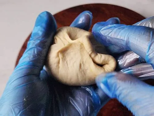sealing the filling inside dough