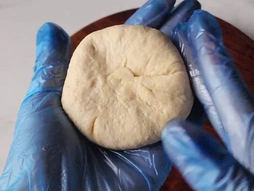 sealed dough ball with stuffing inside